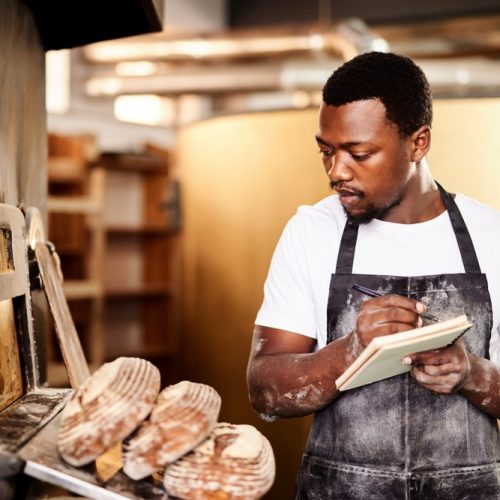 Black,Man,,Bread,And,Notes,For,Baker,,Small,Business,Owner